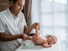 Dad changes diaper